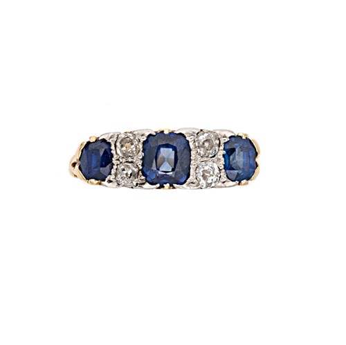 Lot 218 - An early 20th century carved half hoop style ring