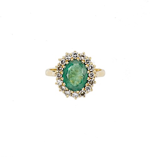 Lot 82 - A late 20th century 18ct gold emerald and diamond cluster ring