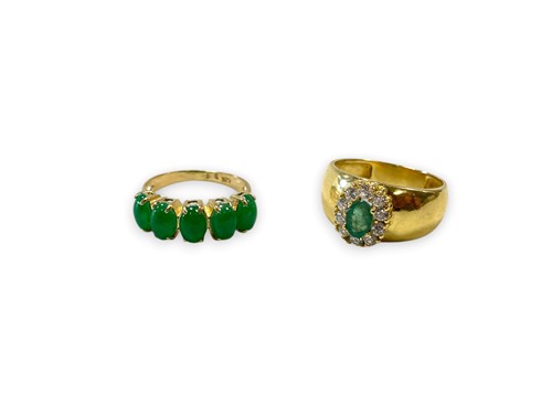 Lot 203 - An emerald and cubic zirconia ring, tested as...