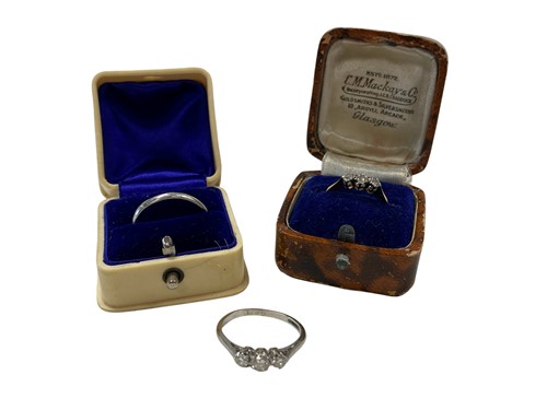 Lot 196 - A three stone diamond ring stamped '18CT&PT',...