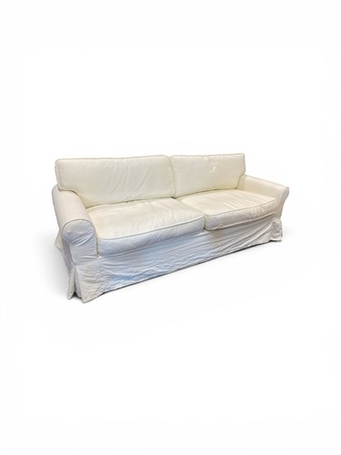 Lot 356 - An OKA Hurlingham light cream sofa 88 x 220 x...