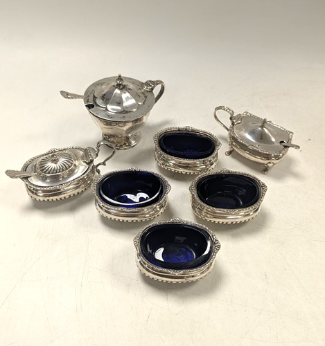 Lot 115 - A set of four salts, together with mustard pots