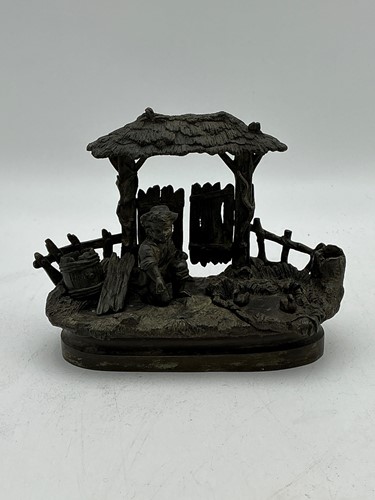 Lot 201 - A bronze inkwell modelled as a figure by a...