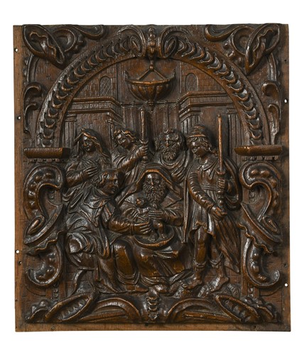 Lot 388 - An oak panel carved with a scene of the Circumcision of Christ, early 17th century