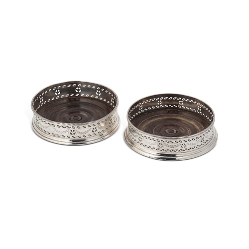 Lot 343 - A pair of George IV silver wine coasters