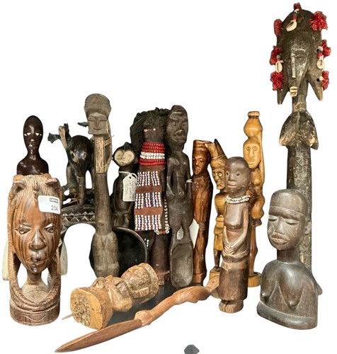 Lot 234 - A group of African tribal carved wood figures,...