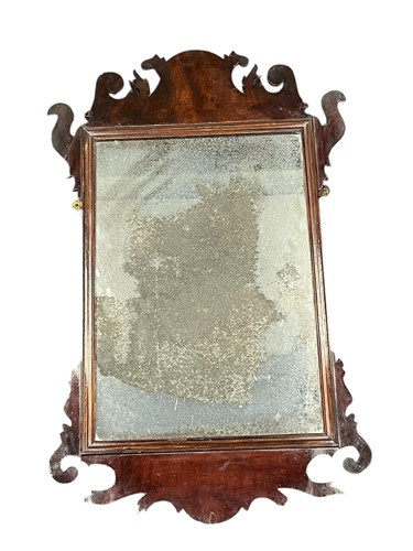 Lot 618 - A George III mahogany fret cut wall mirror