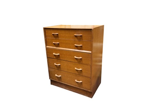 Lot 596 - A G-Plan blonde oak chest of drawers, mid 20th...