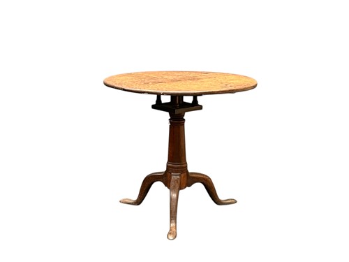 Lot 518 - A late George III oak tripod table, the...