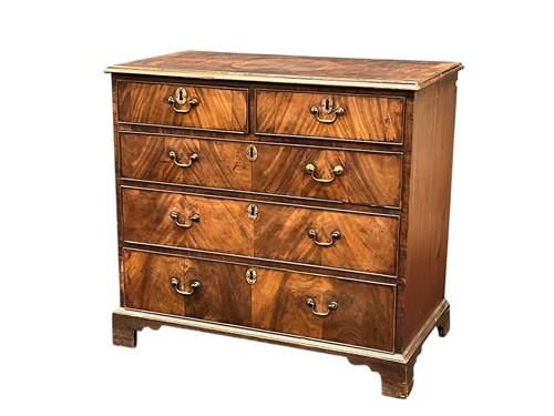 Lot 528 - A walnut chest of drawers, containing 18th...
