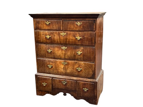 Lot 527 - A walnut chest on stand, 18th century, two...