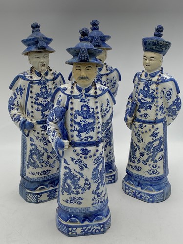 Lot 53 - A group of four figures of Manchu court officials, 20th century