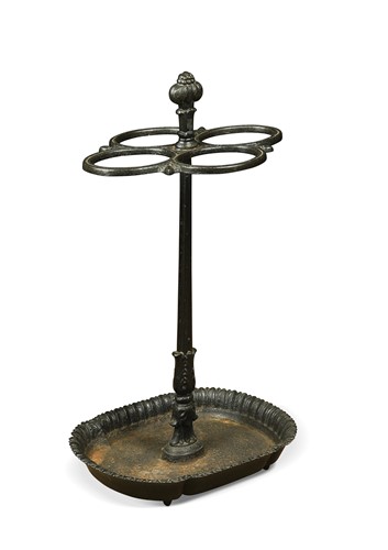 Lot 695 - A black-painted cast iron stick stand, 19th century
