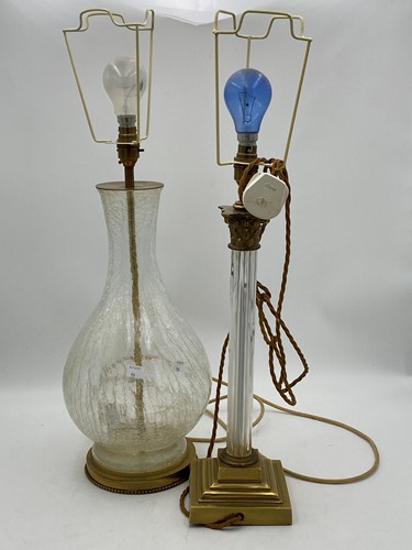 Lot 33 - A baluster shaped crackle glass lamp set on...