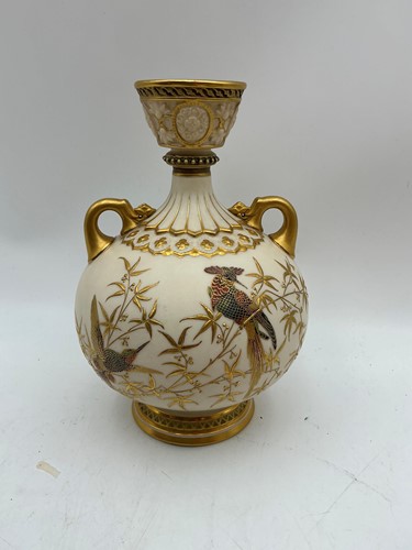Lot 19 - A Royal Worcester ivory ground two-handled...