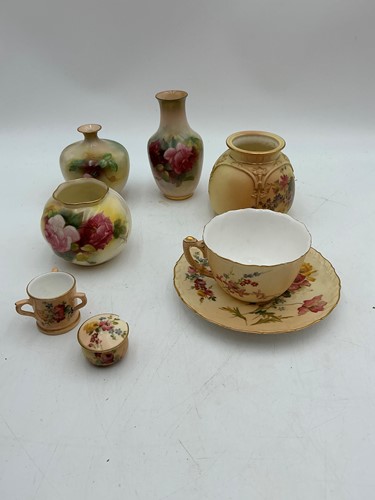 Lot 6 - A Royal Worcester ivory ground wrythen moulded...