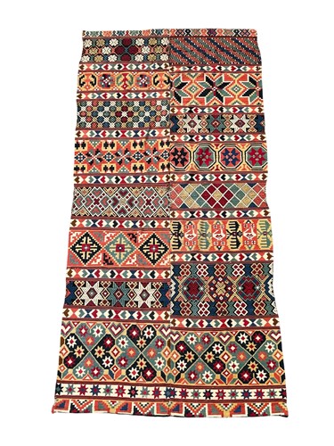 Lot 787 - A colourful Caucasian rug, in two joined...