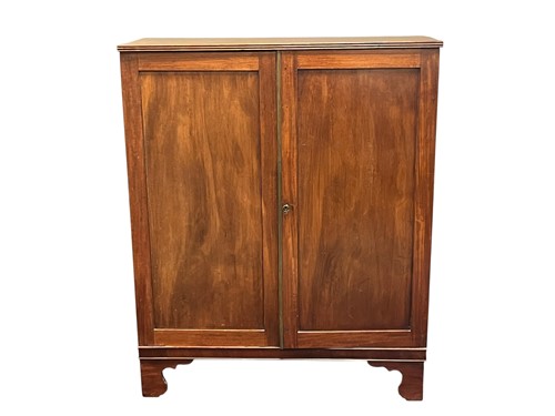 Lot 555 - A mahogany two door cabinet, 19th century, the...