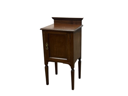 Lot 430 - A mahogany bedside cabinet by Jas Shoolbred,...