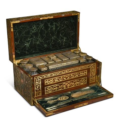 Lot 657 - An early Victorian Irish cut-brass-mounted fruitwood dressing box