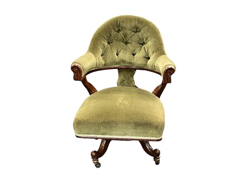 Lot 571 - A late Victorian walnut swivel armchair 97cm high