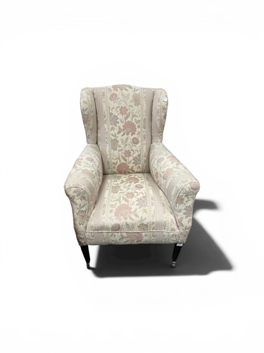 Lot 579 - A small wing chair, 20th century, set on...