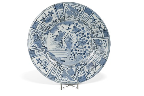 Lot 76 - A large Japanese blue and white porcelain charger, painted in Kraak style