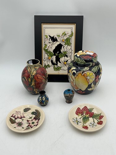 Lot 80 - A Moorcroft pottery group, two miniature vases,...
