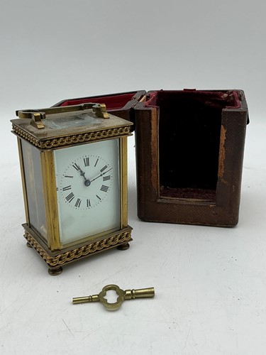 Lot 167 - A brass Carriage clock, cased, with key clock...
