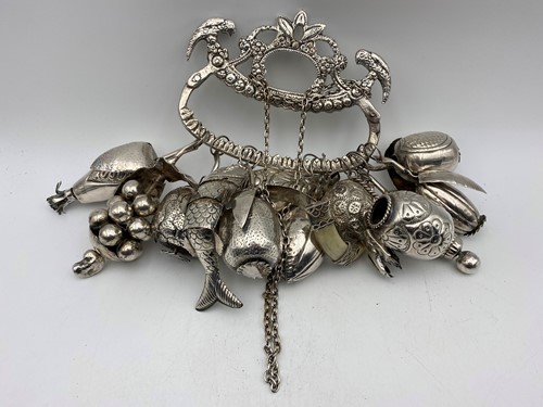 Lot 369 - A South American penca de balangandan amulet,...