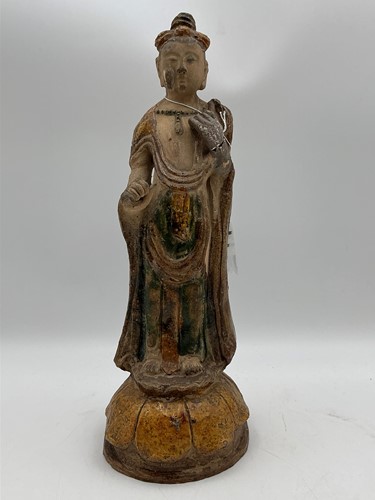 Lot 39 - A Chinese pottery glazed figure standing on a...