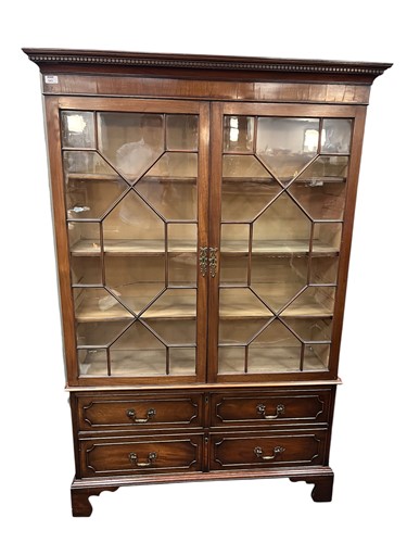 Lot 543 - A George III style mahogany glazed book case,...