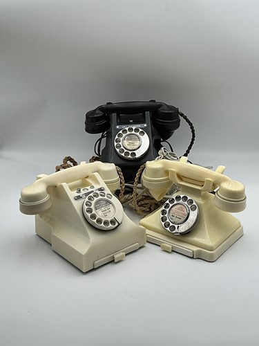 Lot 237 - Three bakelite rotary telephones, 20th century,...