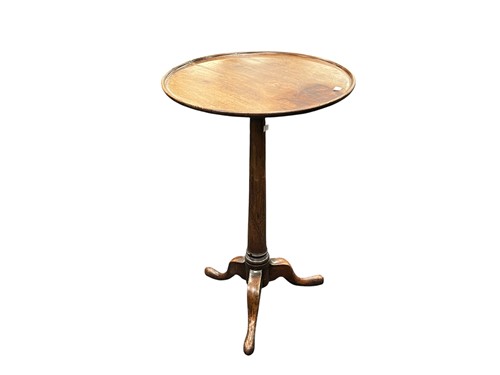 Lot 554 - A mahogany dish top tripod table, 19th century,...