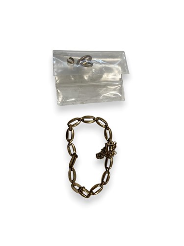 Lot 199 - Cropp & Farr - A hallmarked 9ct gold bracelet,...