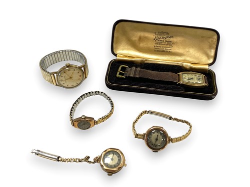 Lot 183 - A 9ct gold watch with a leather strap,...