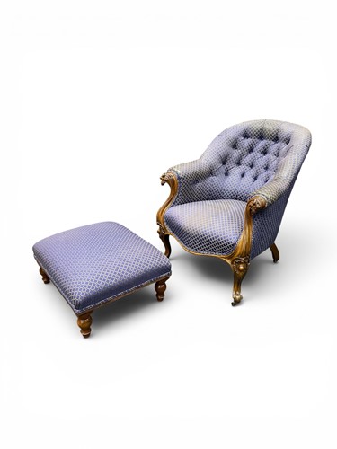 Lot 413 - A deep buttoned Victorian tub armchair with an...