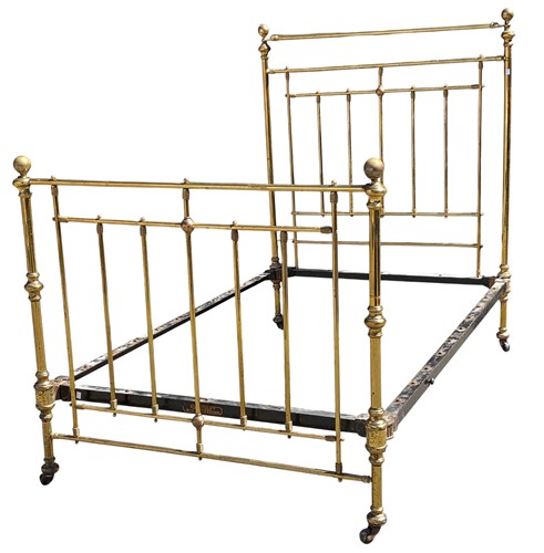Lot 700 - A Victorian brass single bed by Mansergh & Son...