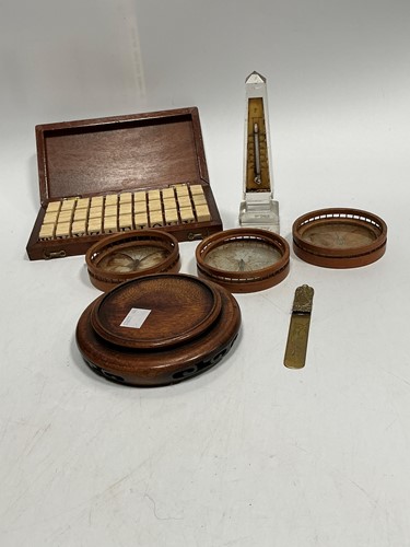Lot 80 - A mahogany cased set of bone letter tiles,...