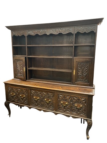 Lot 524 - A carved oak dresser, late 19th/ early 20th...