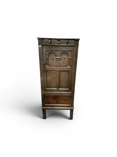 Lot 516 - A 17th century style oak cupboard, the single...