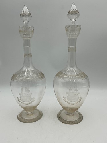 Lot 29 - A pair of etched glass wine decanters and...