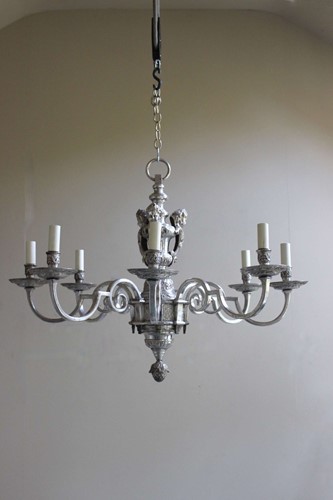 Lot 310 - An eight arm silvered bronze chandelier, late...