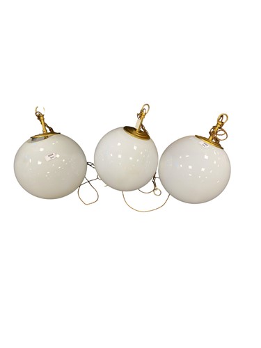 Lot 304 - A set of three opaline glass globe ceiling...