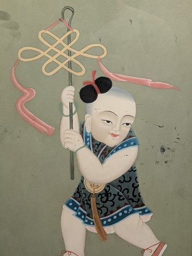 Lot 231 - A Chinese reverse glass painting of a child...