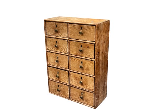 Lot 503 - A small pine bank of ten drawers, 20th century,...