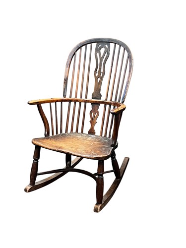Lot 530 - A yew and elm stick back Windsor rocking chair,...