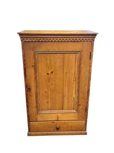 Lot 504 - A pine cupboard, 20th century, with dentil...