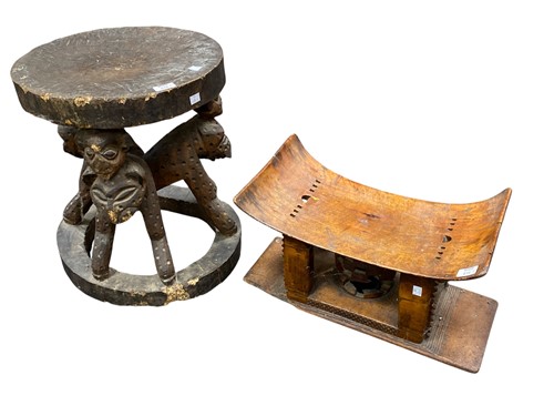 Lot 616 - Two African carved wood stools, early 20th...