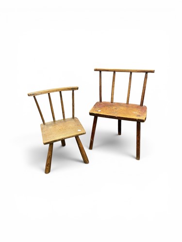 Lot 415 - A primitive elm-seated three-legged chair,...